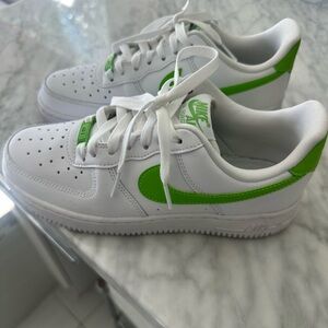 Hardly worn Nike Air Force 1s; white with lime green swoosh, good condition.